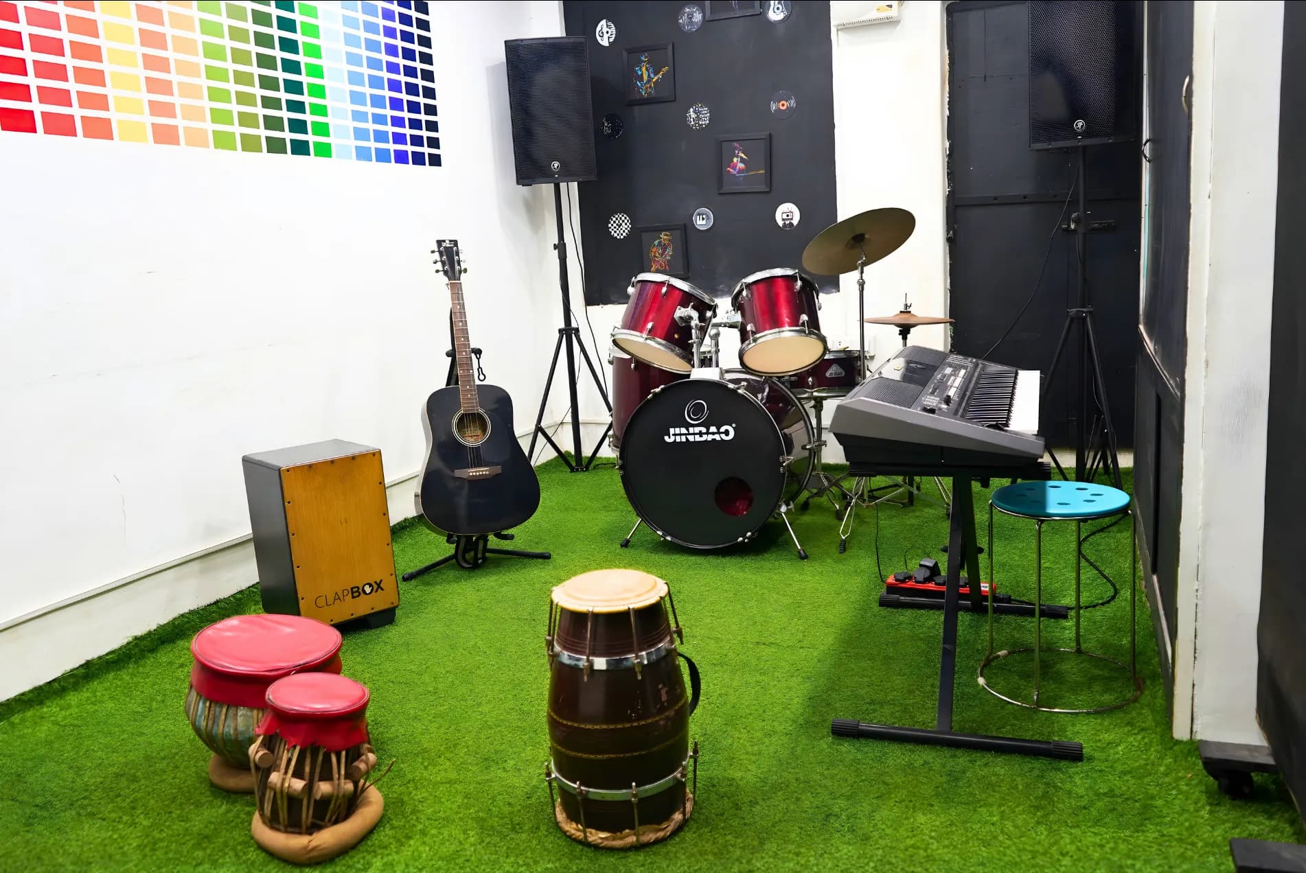 Jamming room with drum kit and guitars at Soundpoint Pro