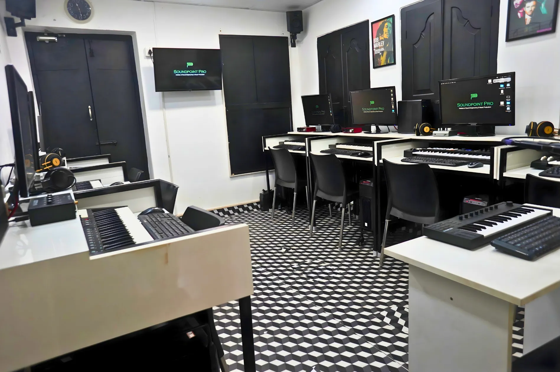 Row of Mac systems loaded with licensed DAW software